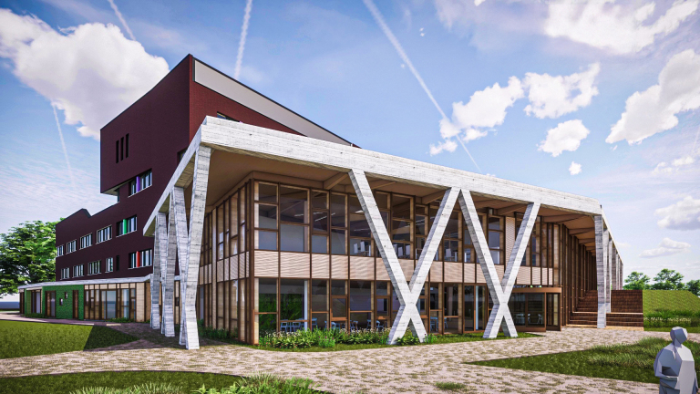 Een modern architectonisch gebouw met grote ramen en witte diagonale steunen, gelegen in een groene omgeving tegen een blauwe lucht met wolken.